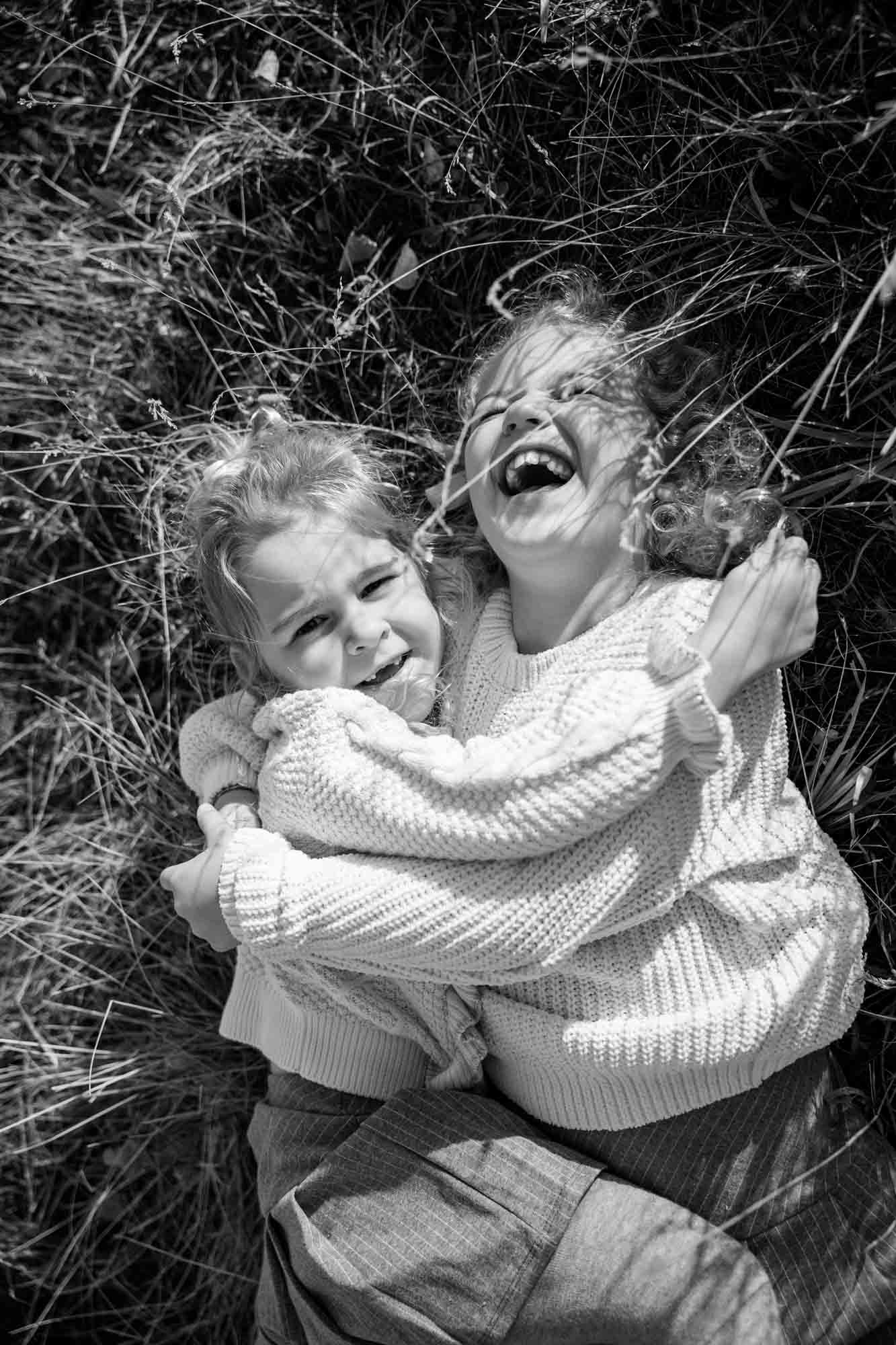Calgary, Banff, Canmore, Kananaskis lifestyle family photographer, family in the mountains at sunset suring their photoshoot, with real candid documentary style