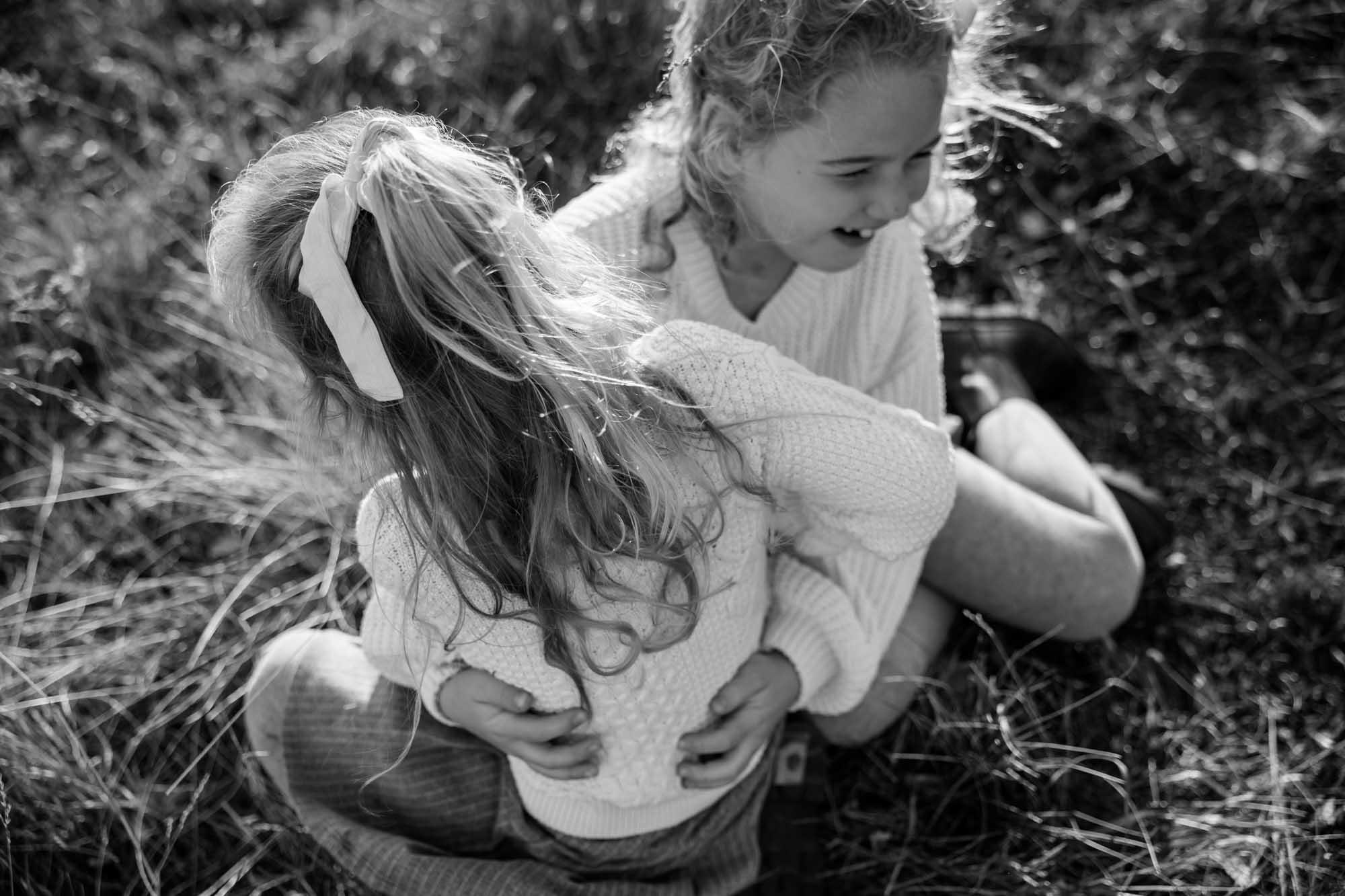 Calgary, Banff, Canmore, Kananaskis lifestyle family photographer, family in the mountains at sunset suring their photoshoot, with real candid documentary style