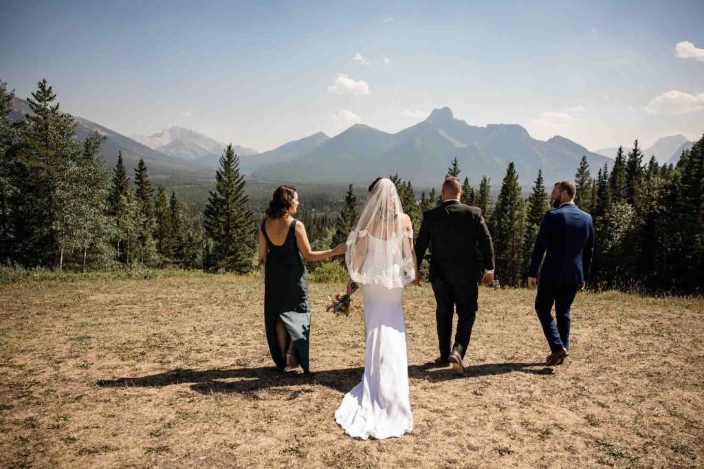 Calgary, Banff, Canmore, Kananaskis Country engagement and wedding photographer, couple on their wedding day at the Pomeroy Kananaskis Lodge, photoshoot in the mountains, storytelling, candid, warm, editorial photography