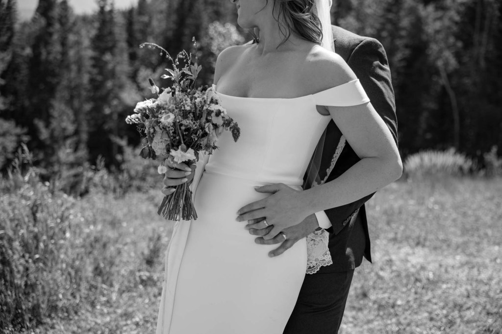 Calgary, Banff, Canmore, Kananaskis Country engagement and wedding photographer, couple on their wedding day at the Pomeroy Kananaskis Lodge, photoshoot in the mountains, storytelling, candid, warm, editorial photography