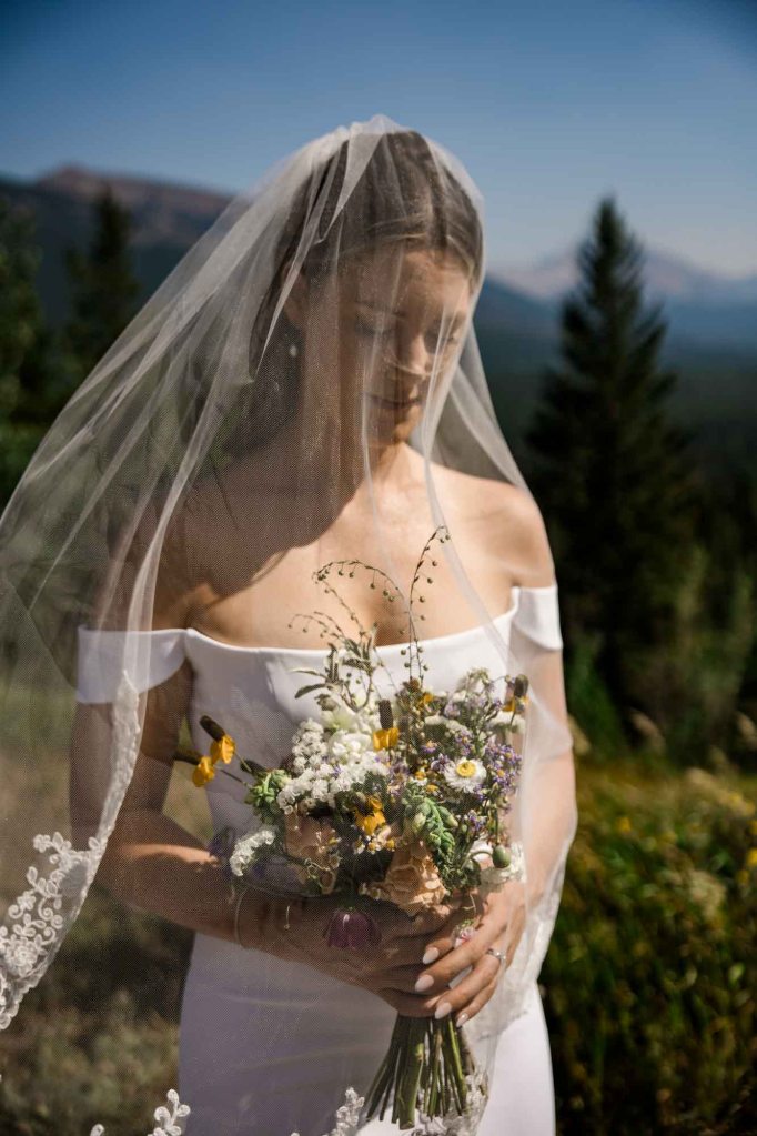 Calgary, Banff, Canmore, Kananaskis Country engagement and wedding photographer, couple on their wedding day at the Pomeroy Kananaskis Lodge, photoshoot in the mountains, storytelling, candid, warm, editorial photography
