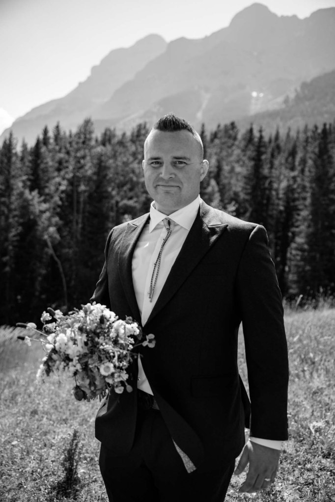 Calgary, Banff, Canmore, Kananaskis Country engagement and wedding photographer, couple on their wedding day at the Pomeroy Kananaskis Lodge, photoshoot in the mountains, storytelling, candid, warm, editorial photography