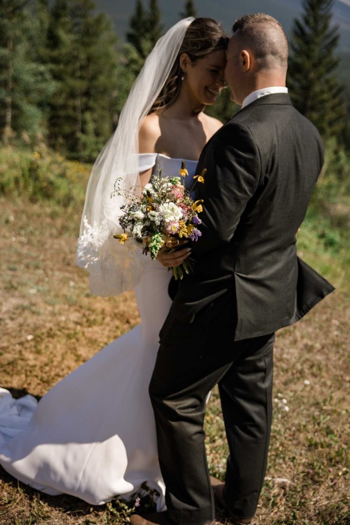 Calgary, Banff, Canmore, Kananaskis Country engagement and wedding photographer, couple on their wedding day at the Pomeroy Kananaskis Lodge, photoshoot in the mountains, storytelling, candid, warm, editorial photography