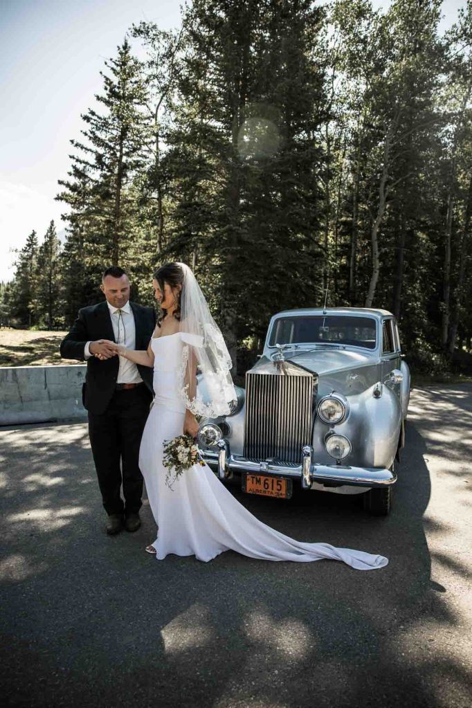 Calgary, Banff, Canmore, Kananaskis Country engagement and wedding photographer, couple on their wedding day at the Pomeroy Kananaskis Lodge, photoshoot in the mountains, storytelling, candid, warm, editorial photography