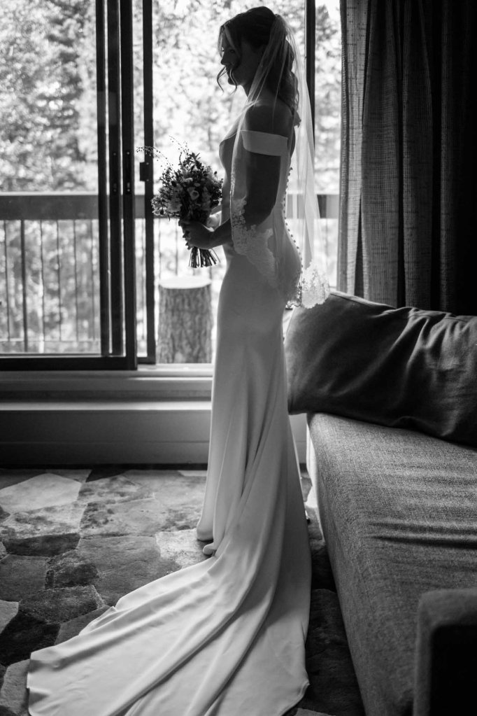 Calgary, Banff, Canmore, Kananaskis Country engagement and wedding photographer, couple on their wedding day at the Pomeroy Kananaskis Lodge, photoshoot in the mountains, storytelling, candid, warm, editorial photography