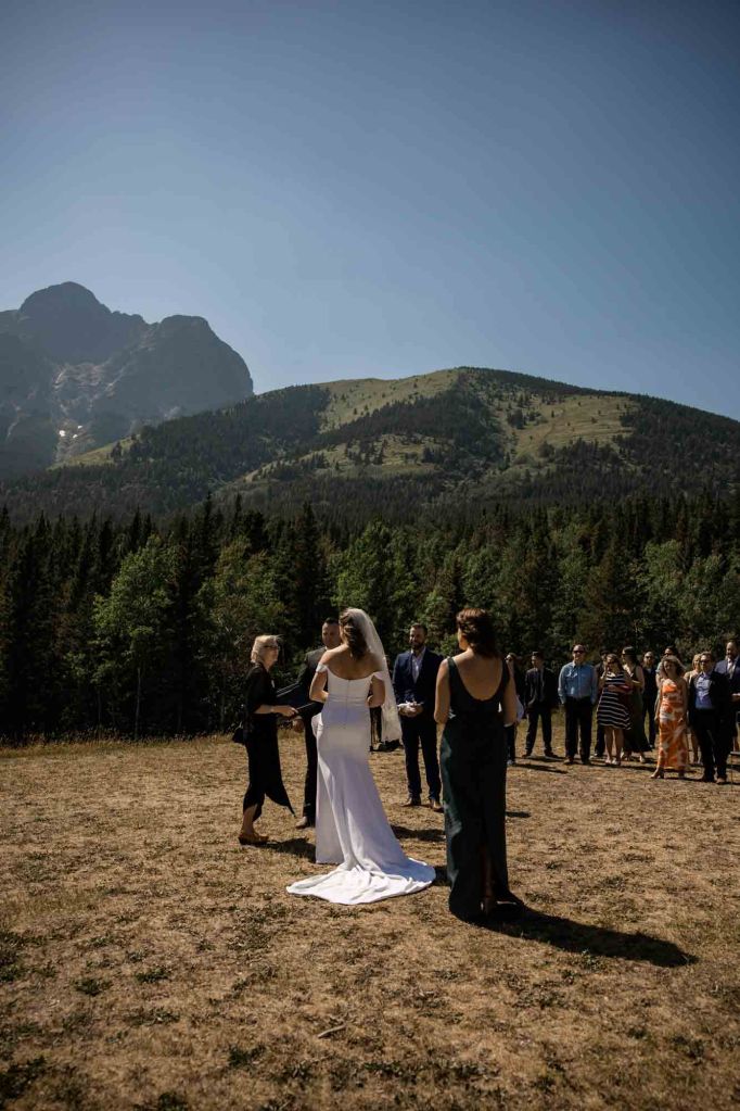 Calgary, Banff, Canmore, Kananaskis Country engagement and wedding photographer, couple on their wedding day at the Pomeroy Kananaskis Lodge, photoshoot in the mountains, storytelling, candid, warm, editorial photography