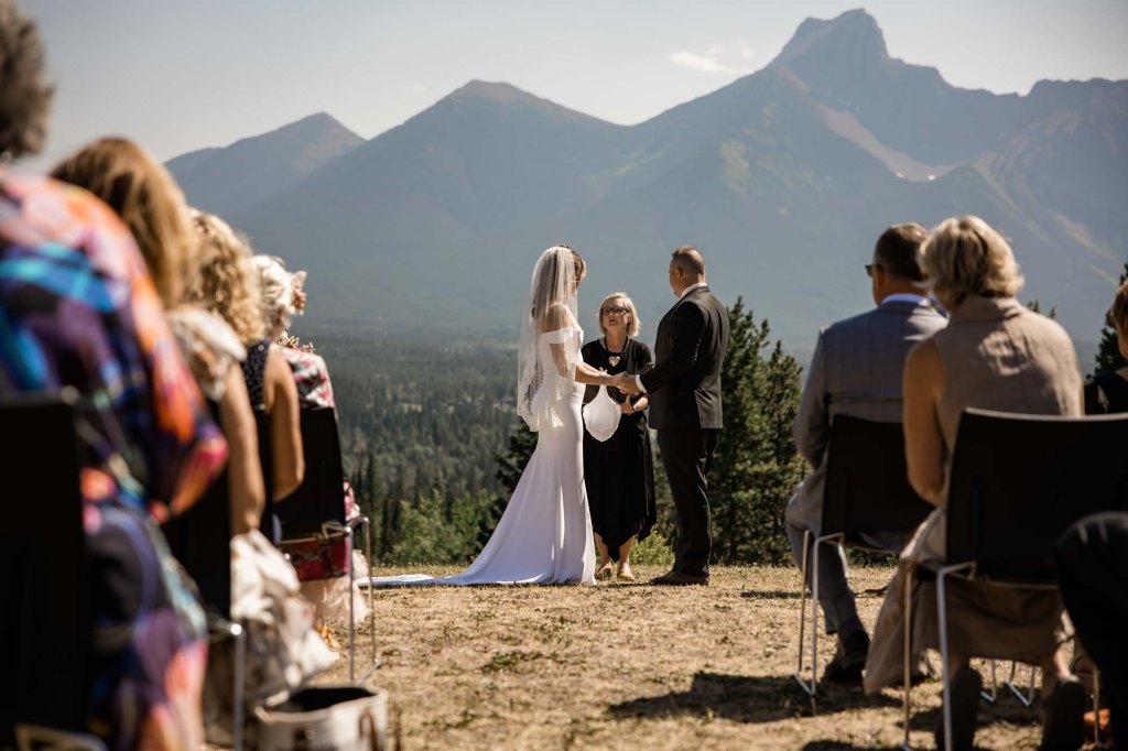 Calgary, Banff, Canmore, Kananaskis Country engagement and wedding photographer, couple on their wedding day at the Pomeroy Kananaskis Lodge, photoshoot in the mountains, storytelling, candid, warm, editorial photography