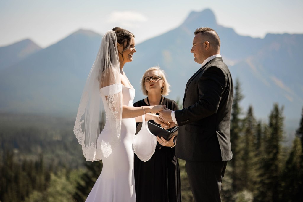 Calgary, Banff, Canmore, Kananaskis Country engagement and wedding photographer, couple on their wedding day at the Pomeroy Kananaskis Lodge, photoshoot in the mountains, storytelling, candid, warm, editorial photography