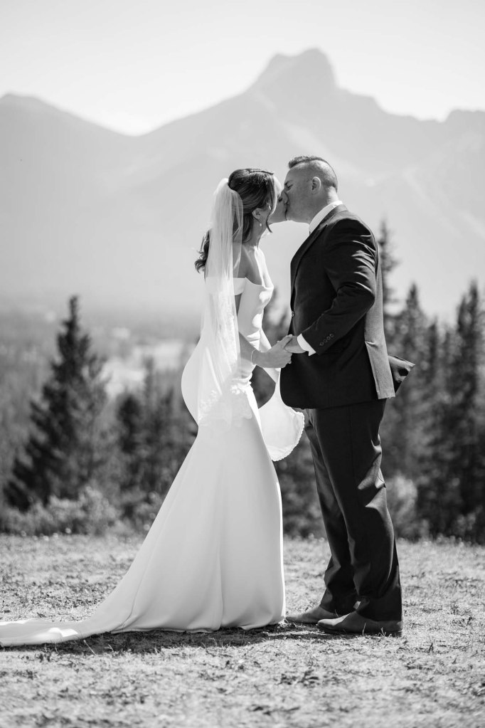 Calgary, Banff, Canmore, Kananaskis Country engagement and wedding photographer, couple on their wedding day at the Pomeroy Kananaskis Lodge, photoshoot in the mountains, storytelling, candid, warm, editorial photography