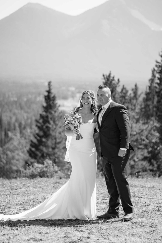 Calgary, Banff, Canmore, Kananaskis Country engagement and wedding photographer, couple on their wedding day at the Pomeroy Kananaskis Lodge, photoshoot in the mountains, storytelling, candid, warm, editorial photography