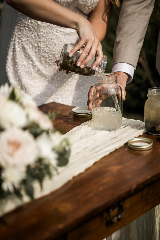 Calgary wedding photographer, bride and groom on their wedding day at Cork and Crate Estates in Olds Alberta, storytelling, candid, warm, editorial wedding photography