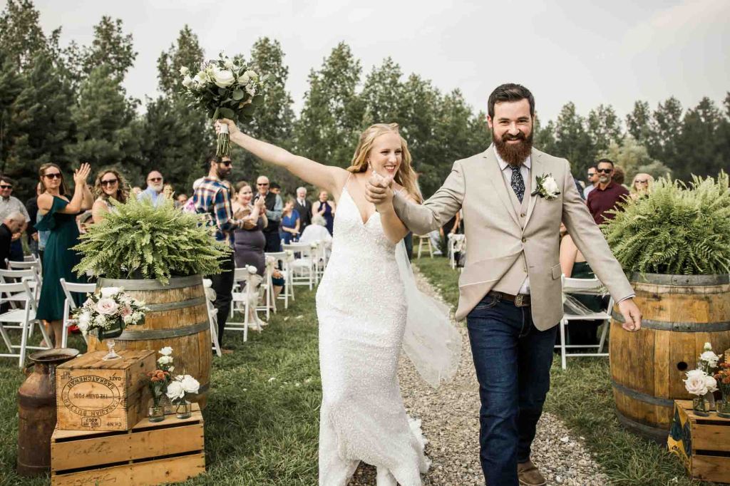 Calgary wedding photographer, bride and groom on their wedding day at Cork and Crate Estates in Olds Alberta, storytelling, candid, warm, editorial wedding photography