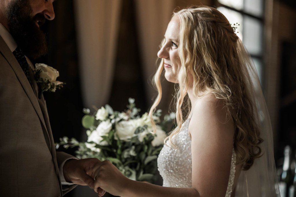 Calgary wedding photographer, bride and groom on their wedding day at Cork and Crate Estates in Olds Alberta, storytelling, candid, warm, editorial wedding photography
