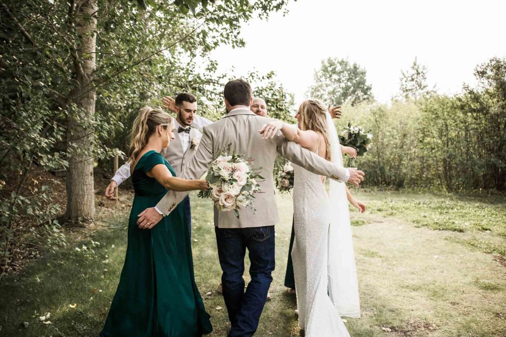 Calgary wedding photographer, bride and groom on their wedding day at Cork and Crate Estates in Olds Alberta, storytelling, candid, warm, editorial wedding photography