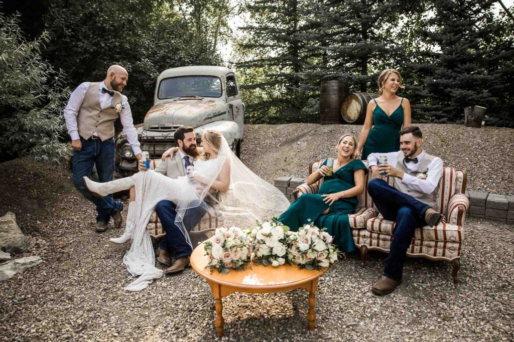 Calgary wedding photographer, bride and groom on their wedding day at Cork and Crate Estates in Olds Alberta, storytelling, candid, warm, editorial wedding photography