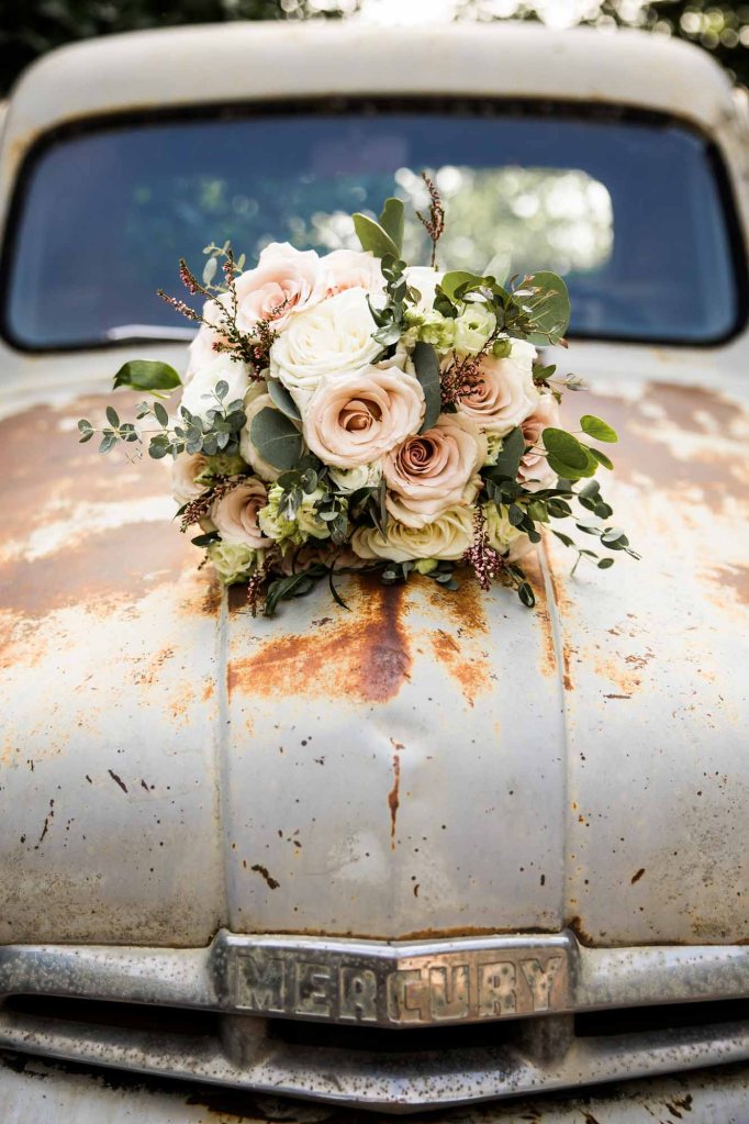 Calgary wedding photographer, bride and groom on their wedding day at Cork and Crate Estates in Olds Alberta, storytelling, candid, warm, editorial wedding photography