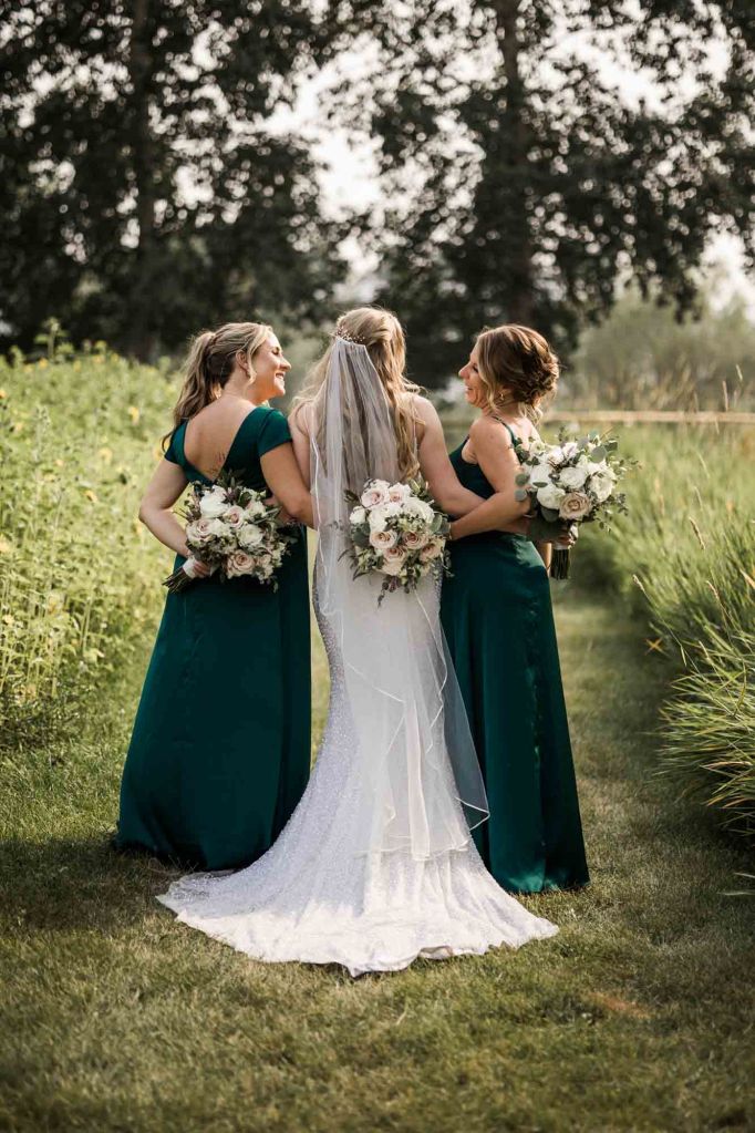 Calgary wedding photographer, bride and groom on their wedding day at Cork and Crate Estates in Olds Alberta, storytelling, candid, warm, editorial wedding photography