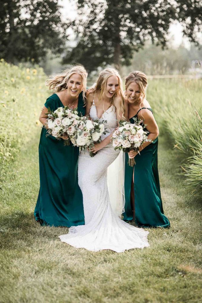 Calgary wedding photographer, bride and groom on their wedding day at Cork and Crate Estates in Olds Alberta, storytelling, candid, warm, editorial wedding photography