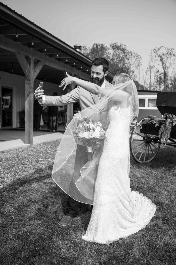 Calgary wedding photographer, bride and groom on their wedding day at Cork and Crate Estates in Olds Alberta, storytelling, candid, warm, editorial wedding photography