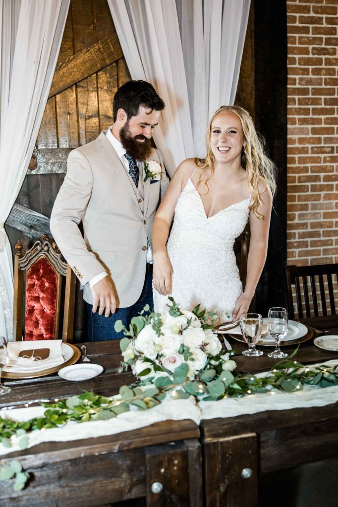 Calgary wedding photographer, bride and groom on their wedding day at Cork and Crate Estates in Olds Alberta, storytelling, candid, warm, editorial wedding photography