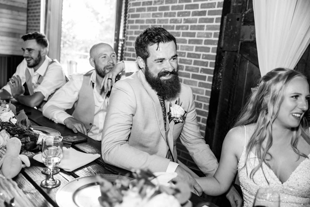 Calgary wedding photographer, bride and groom on their wedding day at Cork and Crate Estates in Olds Alberta, storytelling, candid, warm, editorial wedding photography