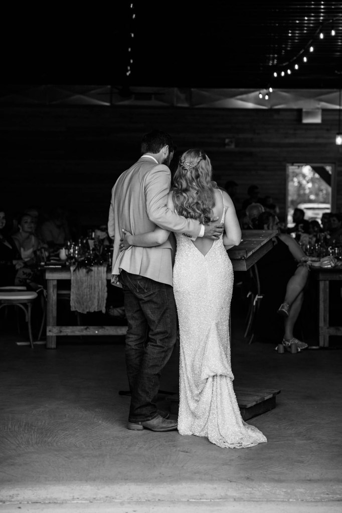 Calgary wedding photographer, bride and groom on their wedding day at Cork and Crate Estates in Olds Alberta, storytelling, candid, warm, editorial wedding photography