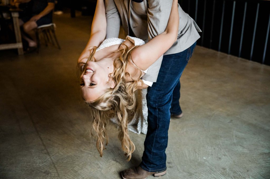Calgary wedding photographer, bride and groom on their wedding day at Cork and Crate Estates in Olds Alberta, storytelling, candid, warm, editorial wedding photography