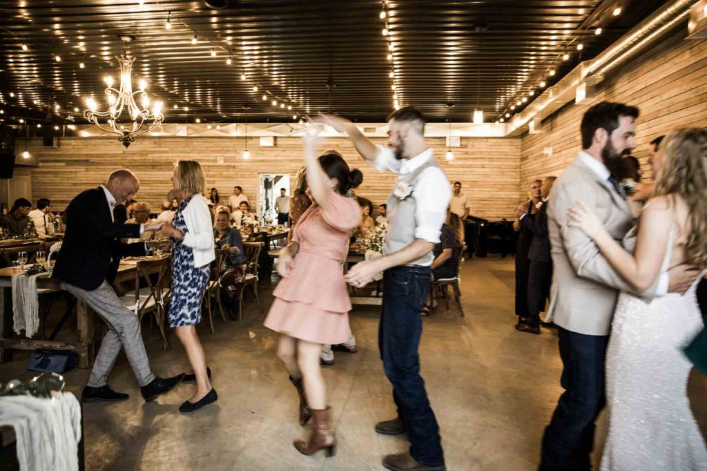 Calgary wedding photographer, bride and groom on their wedding day at Cork and Crate Estates in Olds Alberta, storytelling, candid, warm, editorial wedding photography