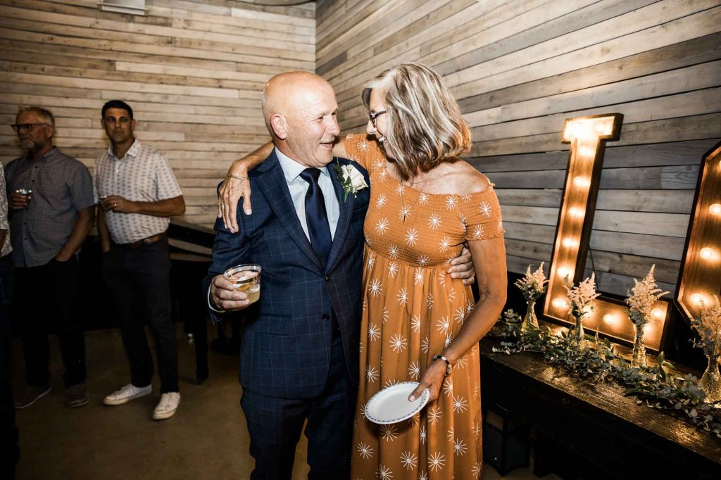 Calgary wedding photographer, bride and groom on their wedding day at Cork and Crate Estates in Olds Alberta, storytelling, candid, warm, editorial wedding photography