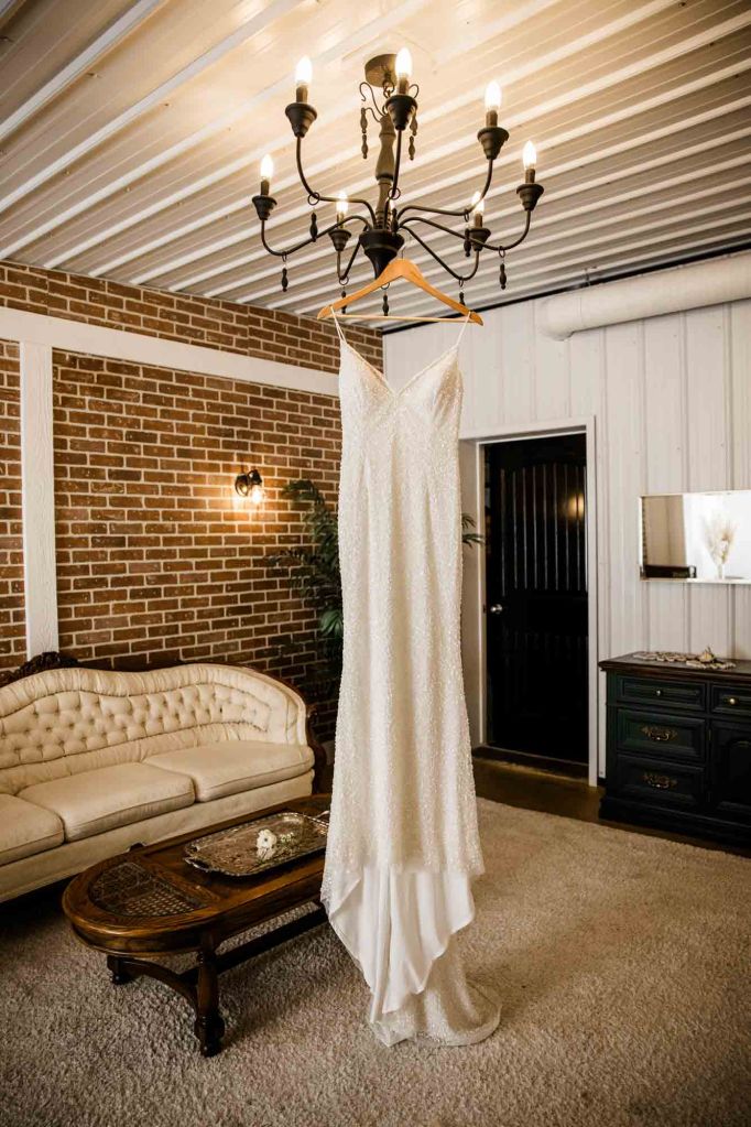 Calgary wedding photographer, bride and groom on their wedding day at Cork and Crate Estates in Olds Alberta, storytelling, candid, warm, editorial wedding photography