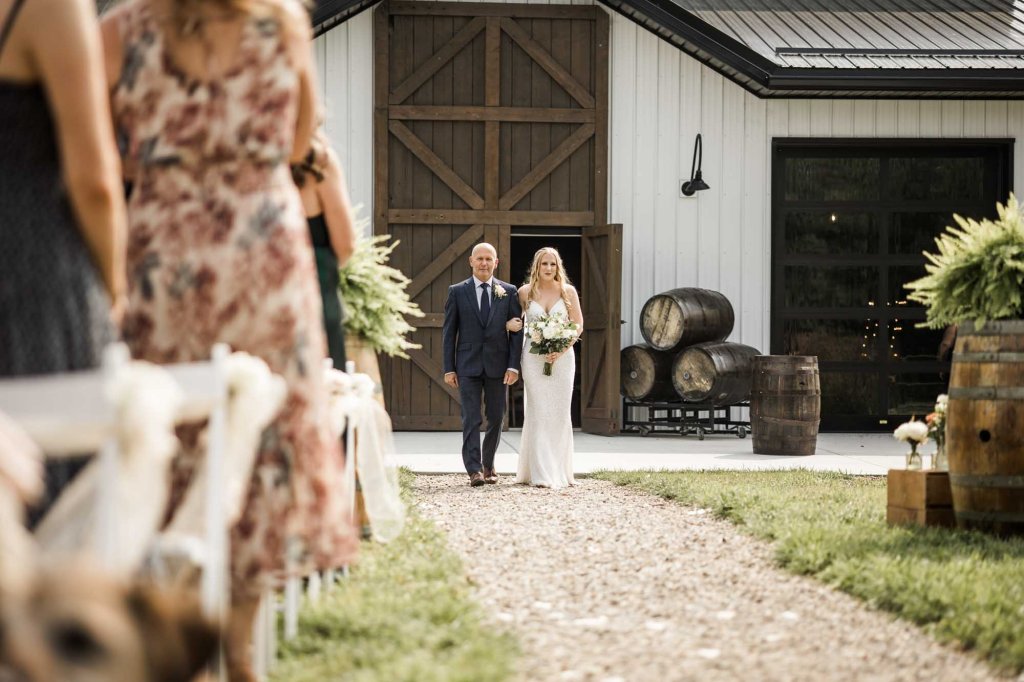 Calgary wedding photographer, bride and groom on their wedding day at Cork and Crate Estates in Olds Alberta, storytelling, candid, warm, editorial wedding photography