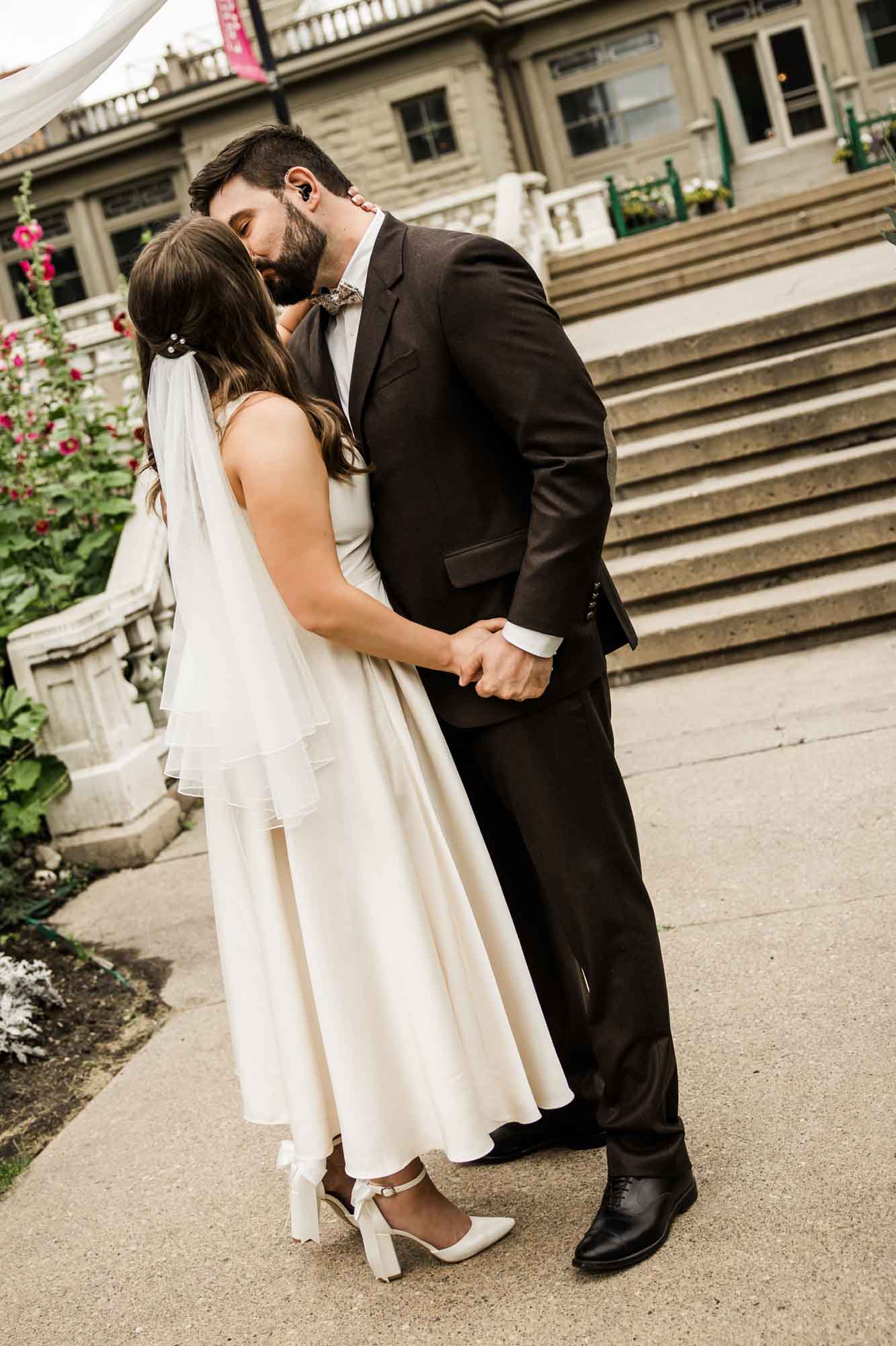 Calgary wedding photographer, couple on their wedding day at Lougheed House, photography in an editorial style with vintage bridal attire and venue