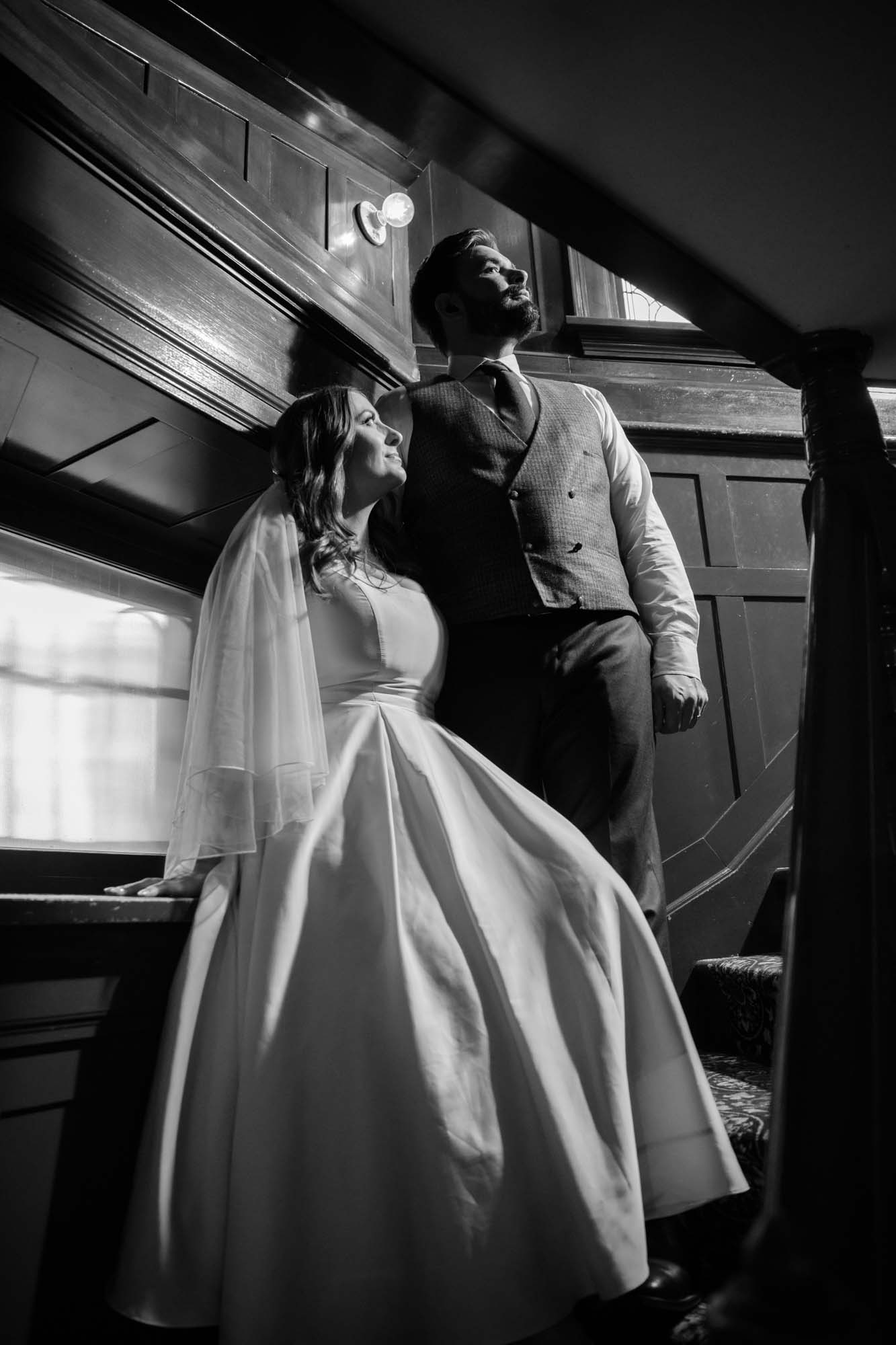 Calgary wedding photographer, couple on their wedding day at Lougheed House, photography in an editorial style with vintage bridal attire and venue