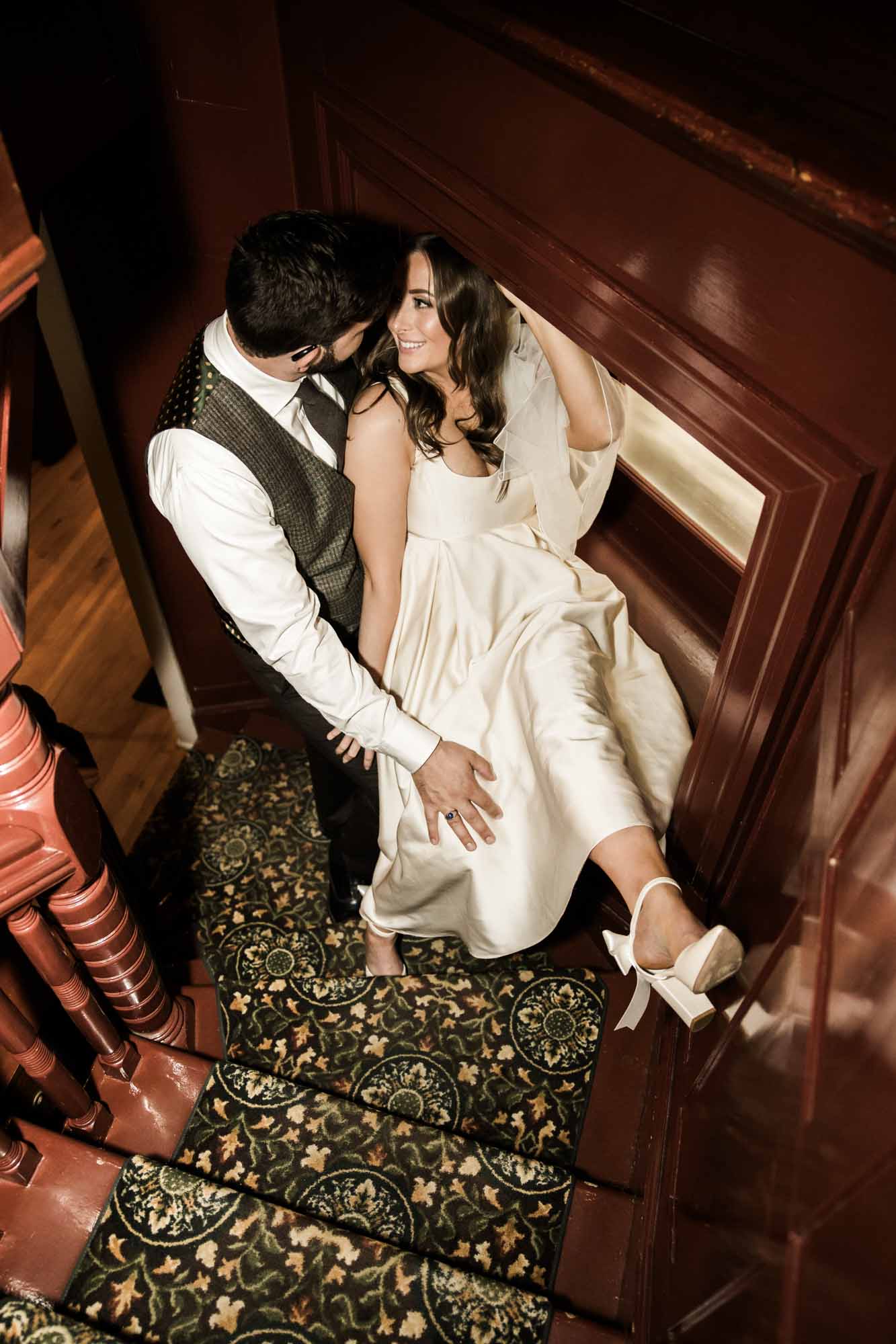 Calgary wedding photographer, couple on their wedding day at Lougheed House, photography in an editorial style with vintage bridal attire and venue