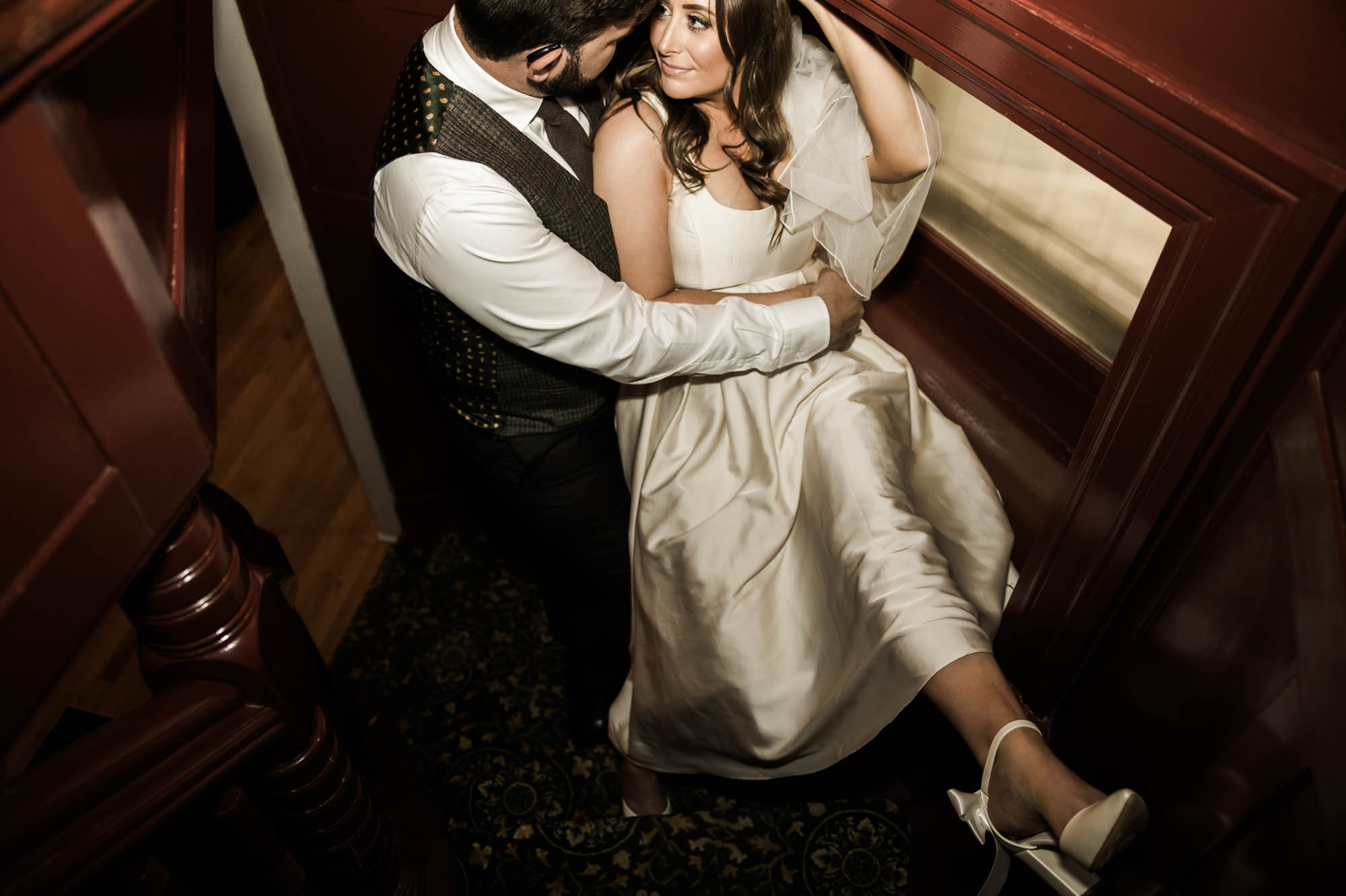 Calgary wedding photographer, couple on their wedding day at Lougheed House, photography in an editorial style with vintage bridal attire and venue