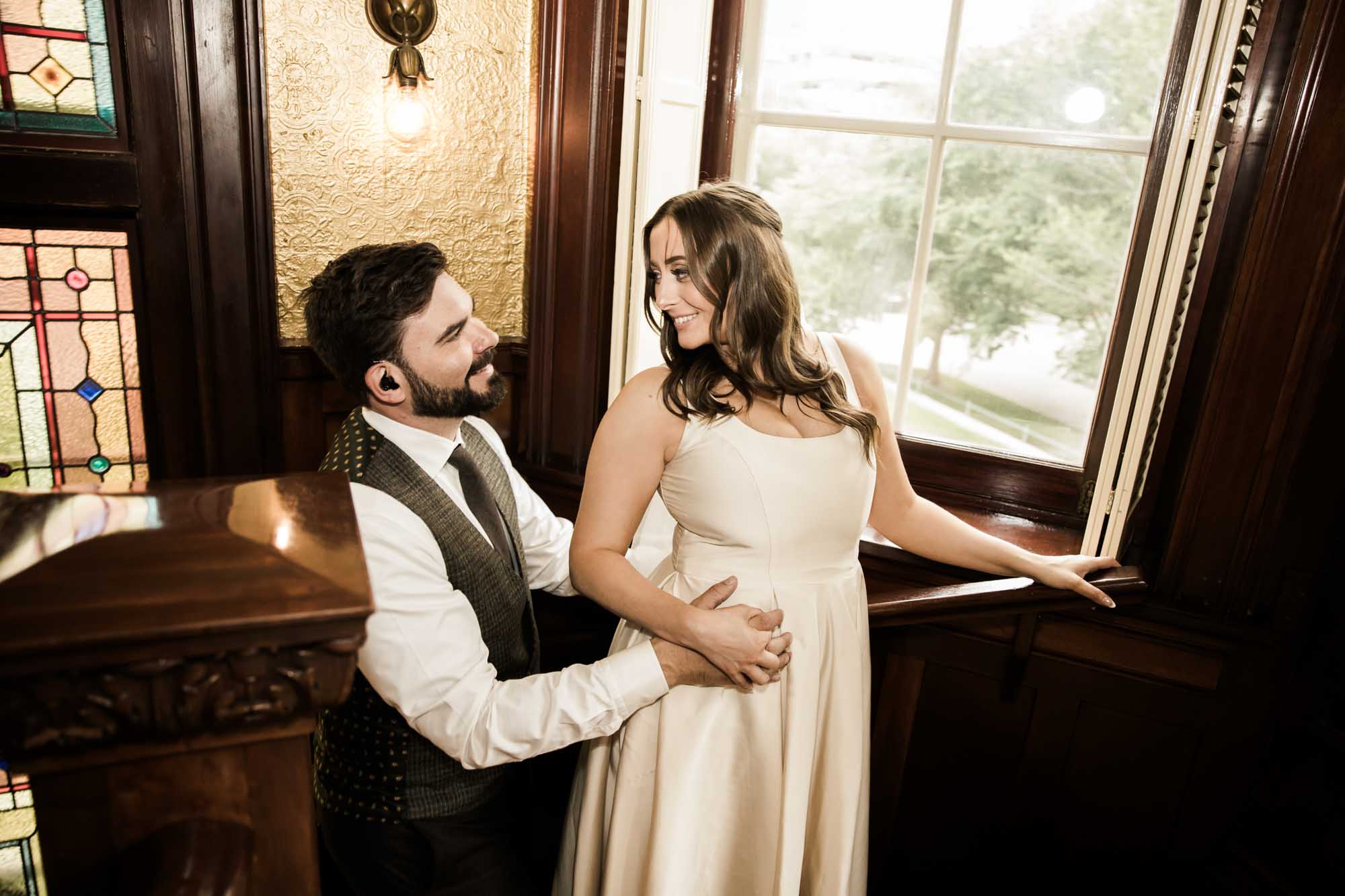 Calgary wedding photographer, couple on their wedding day at Lougheed House, photography in an editorial style with vintage bridal attire and venue