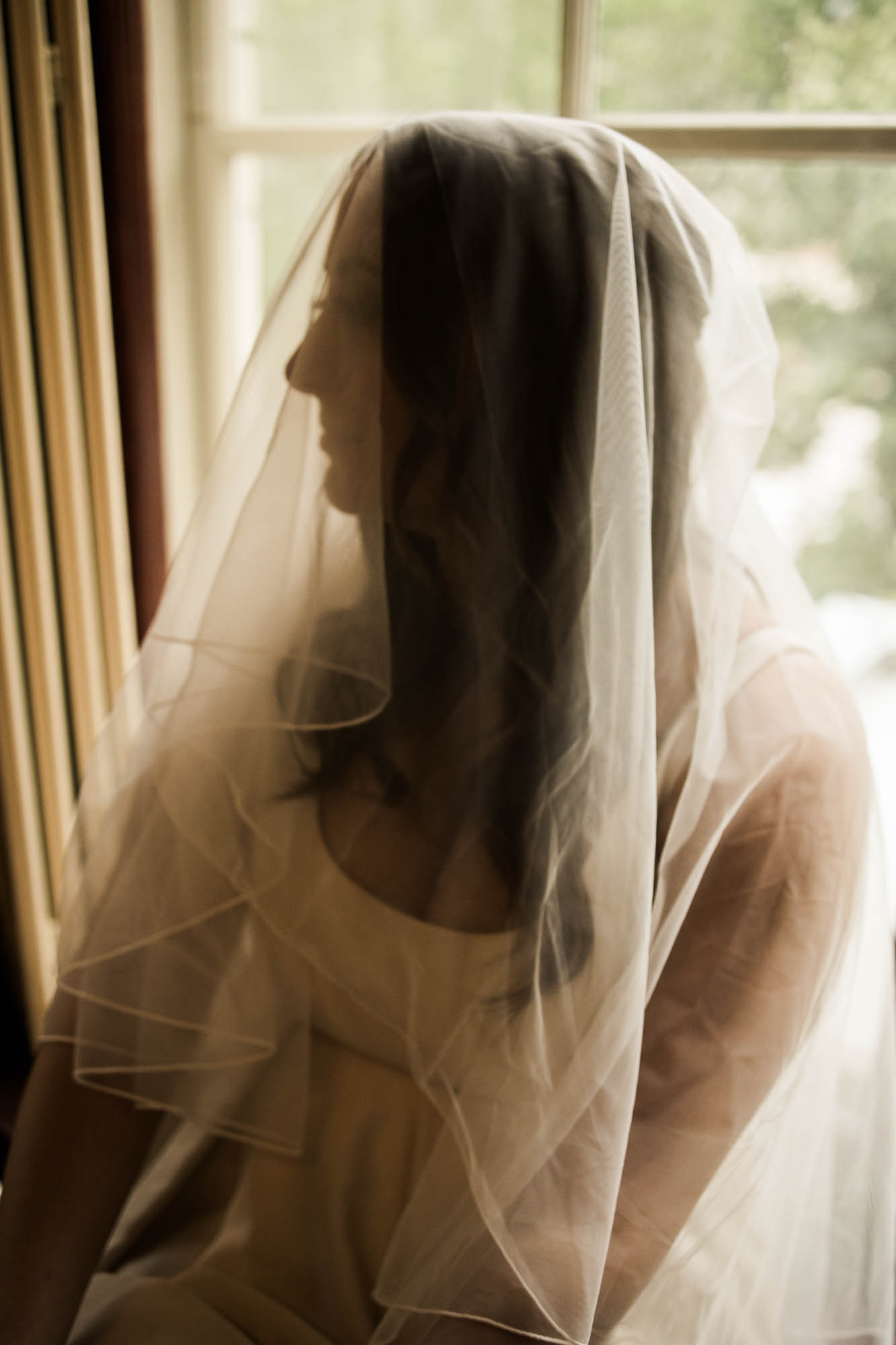 Calgary wedding photographer, couple on their wedding day at Lougheed House, photography in an editorial style with vintage bridal attire and venue