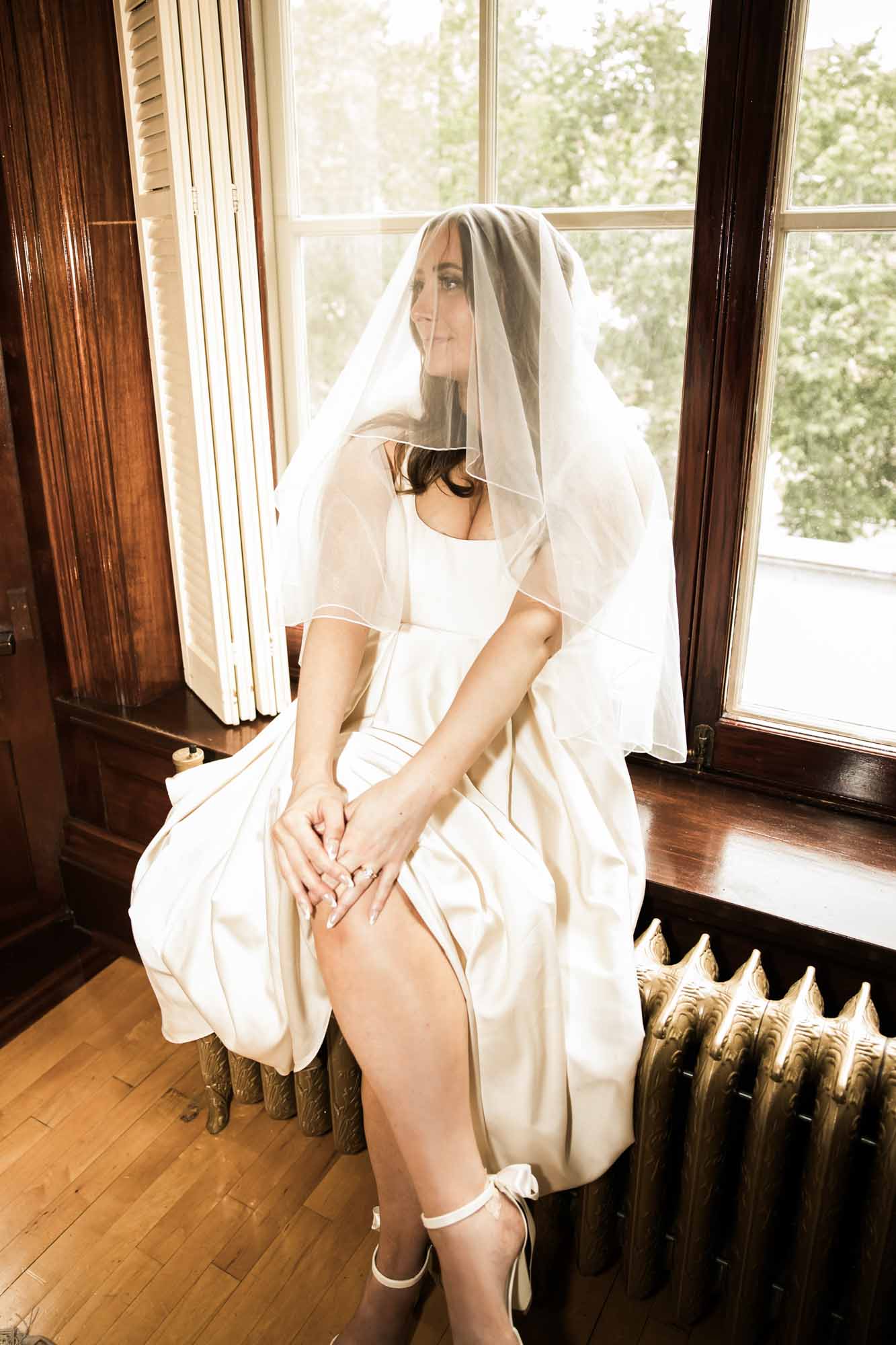 Calgary wedding photographer, couple on their wedding day at Lougheed House, photography in an editorial style with vintage bridal attire and venue