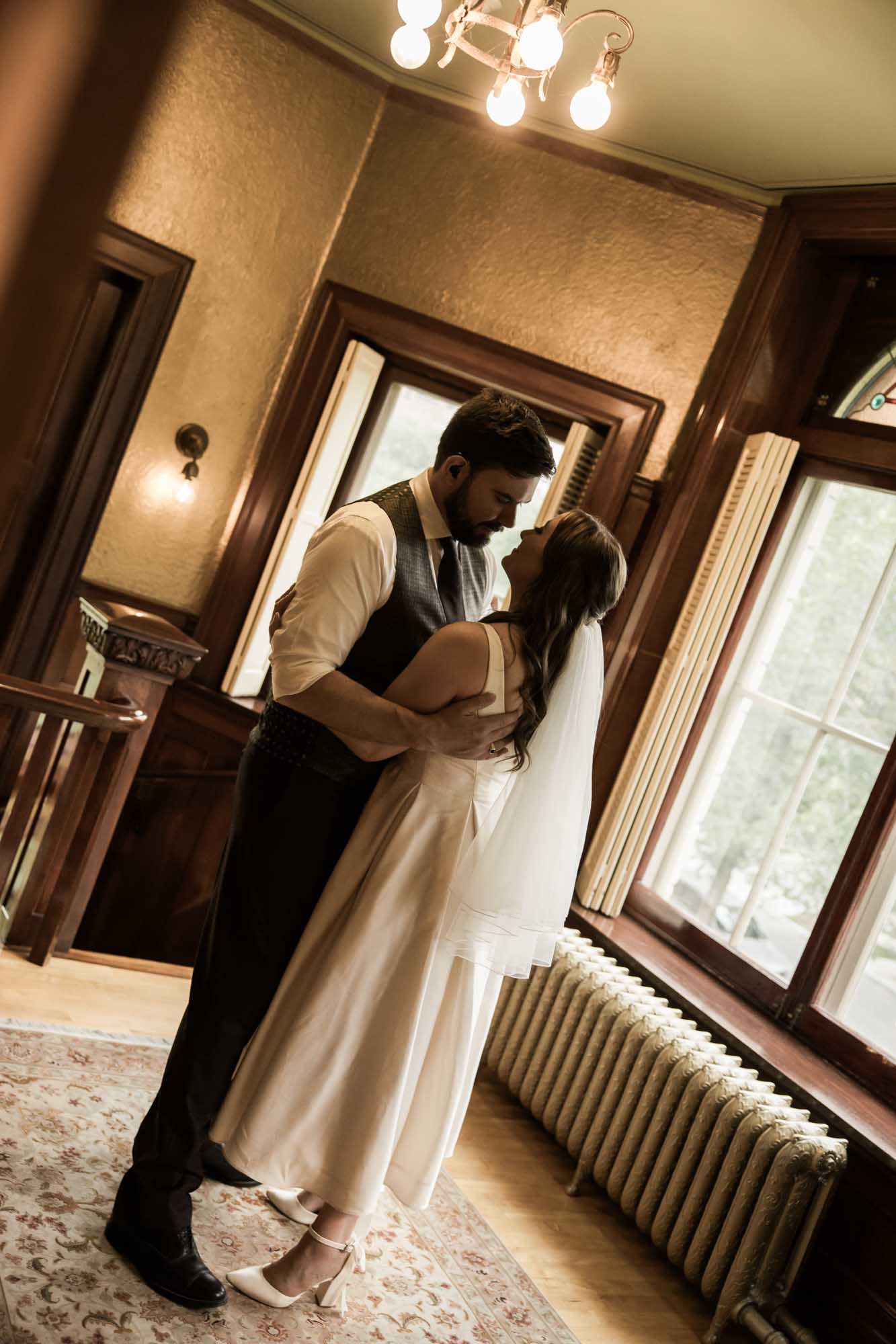 Calgary wedding photographer, couple on their wedding day at Lougheed House, photography in an editorial style with vintage bridal attire and venue