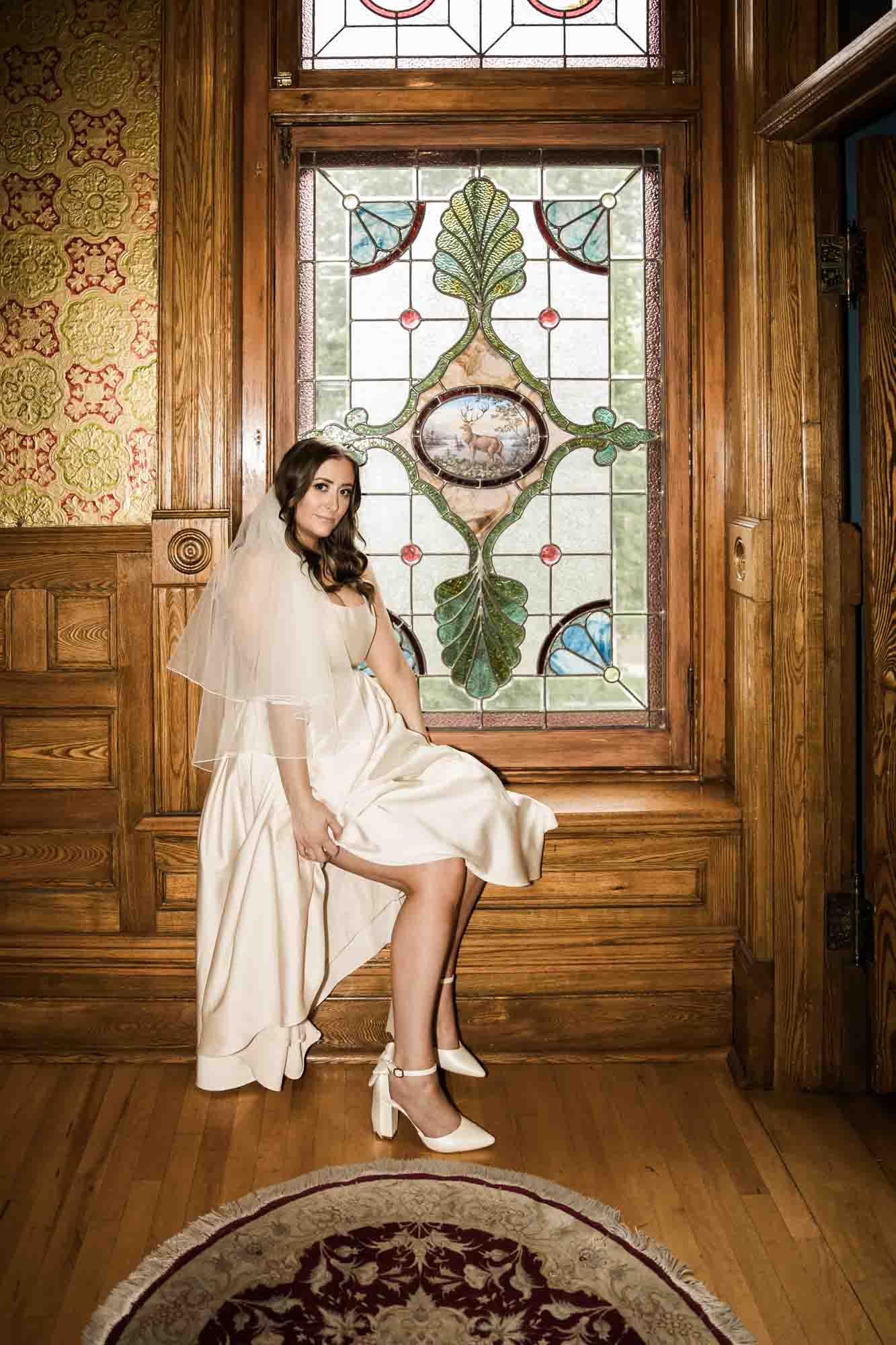 Calgary wedding photographer, couple on their wedding day at Lougheed House, photography in an editorial style with vintage bridal attire and venue