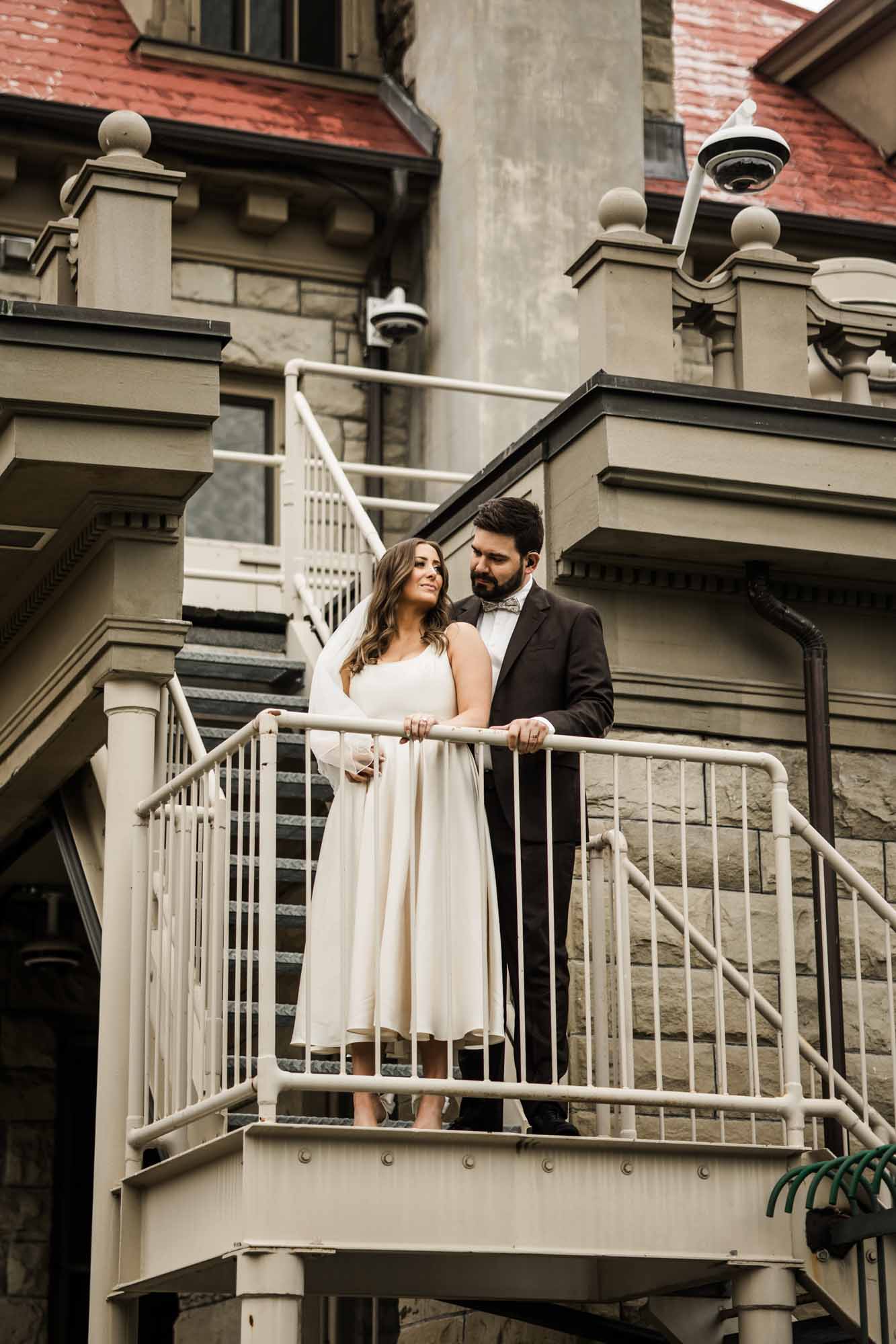 Calgary wedding photographer, couple on their wedding day at Lougheed House, photography in an editorial style with vintage bridal attire and venue