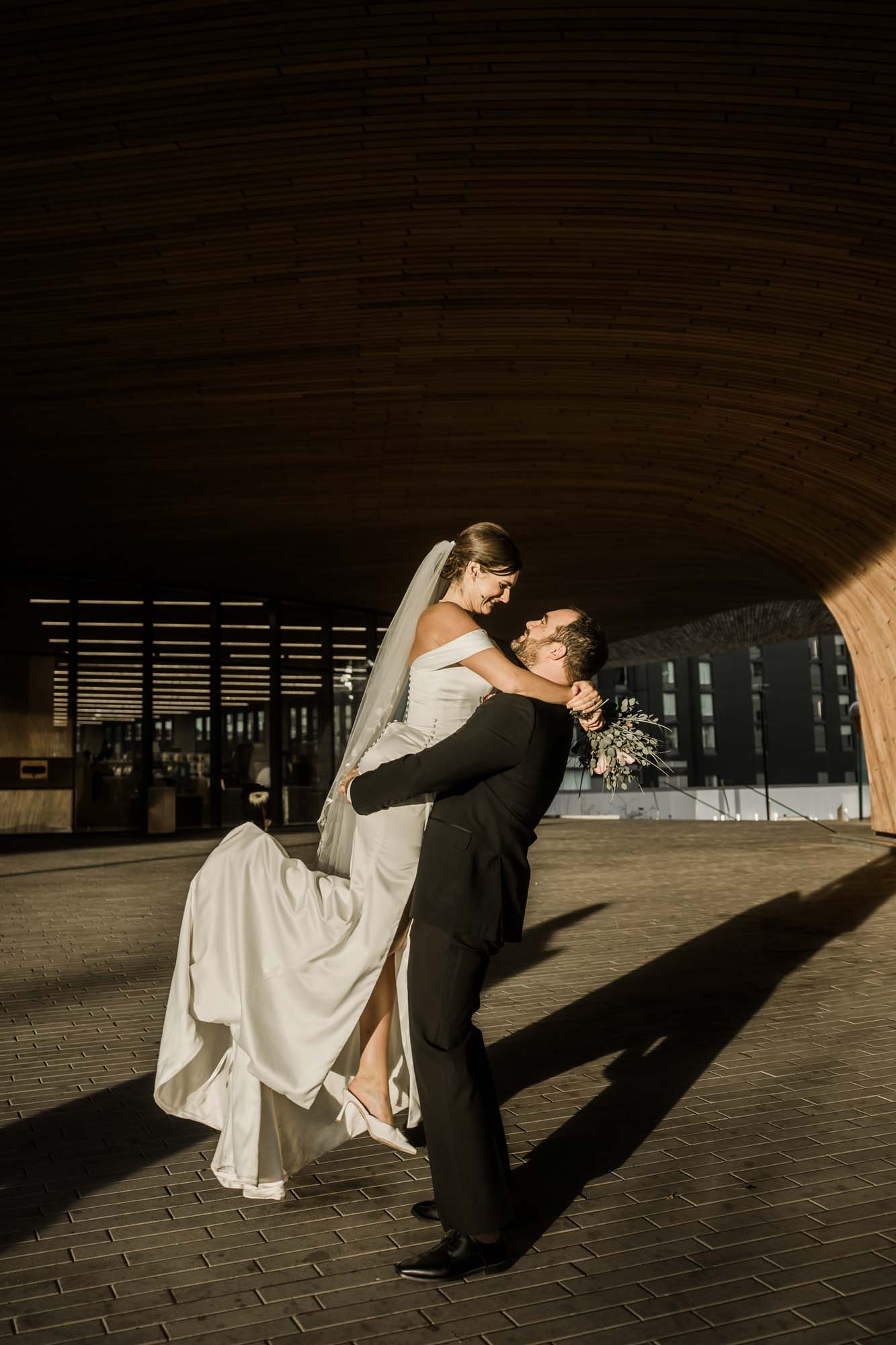 Calgary wedding photographer, bride and groom on their wedding day at the Central Library, candid, documentary, storytelling photography