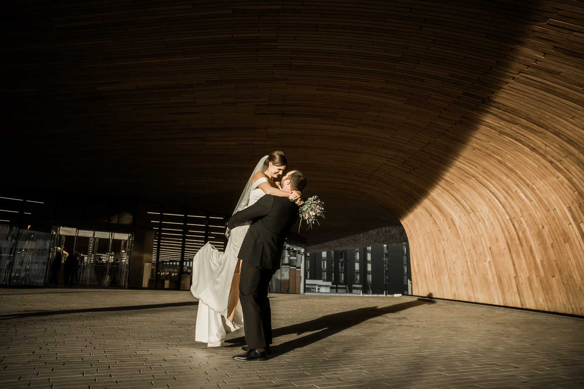 Calgary wedding photographer, bride and groom on their wedding day at the Central Library, candid, documentary, storytelling photography