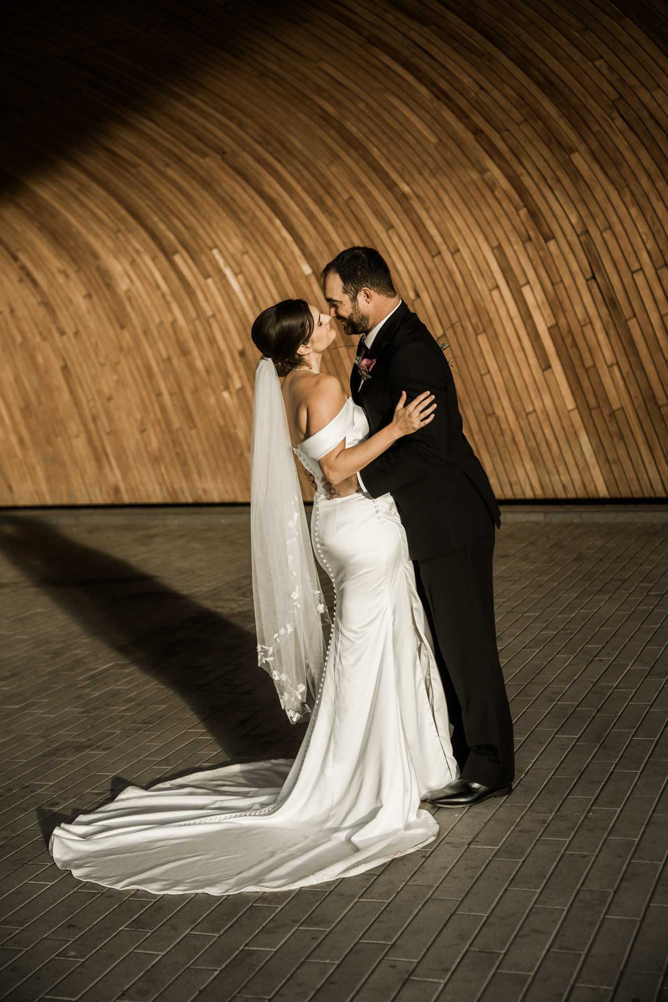 Calgary wedding photographer, bride and groom on their wedding day at the Central Library, candid, documentary, storytelling photography