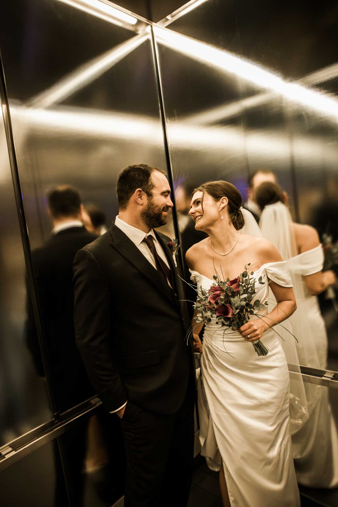 Calgary wedding photographer, bride and groom on their wedding day at the Central Library, candid, documentary, storytelling photography