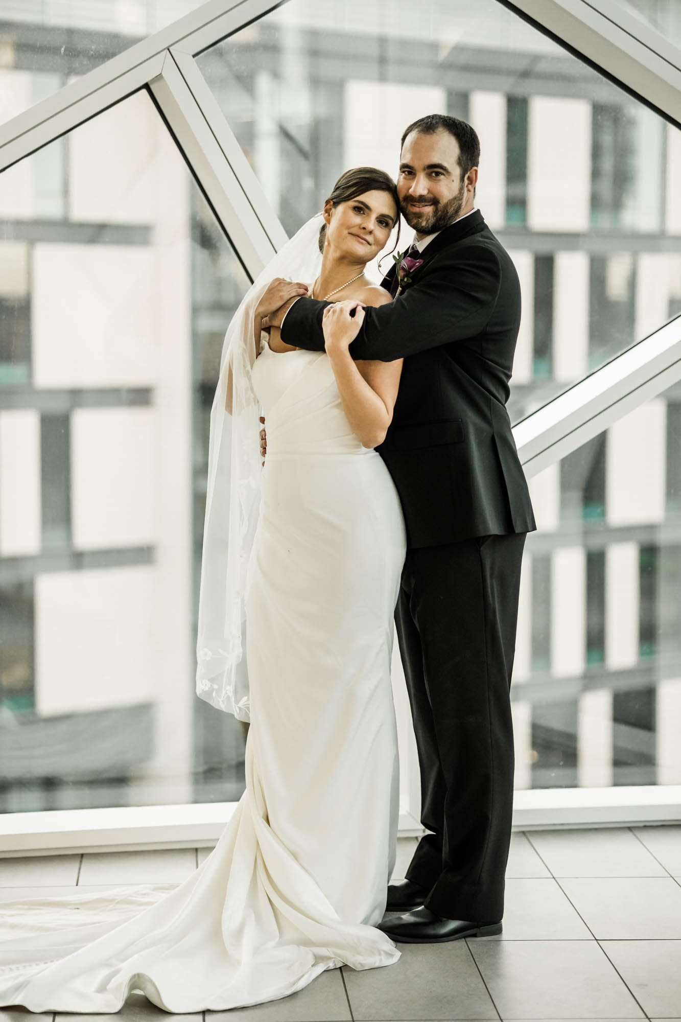 Calgary wedding photographer, bride and groom on their wedding day at the Central Library, candid, documentary, storytelling photography