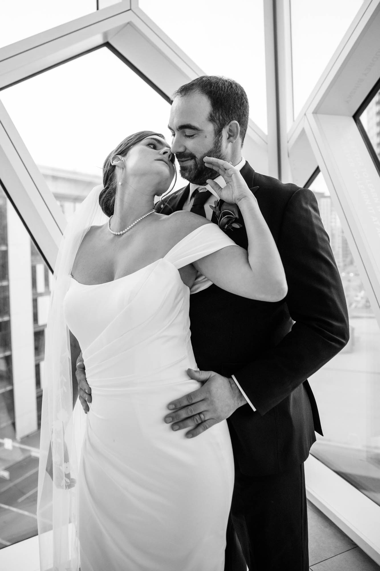 Calgary wedding photographer, bride and groom on their wedding day at the Central Library, candid, documentary, storytelling photography