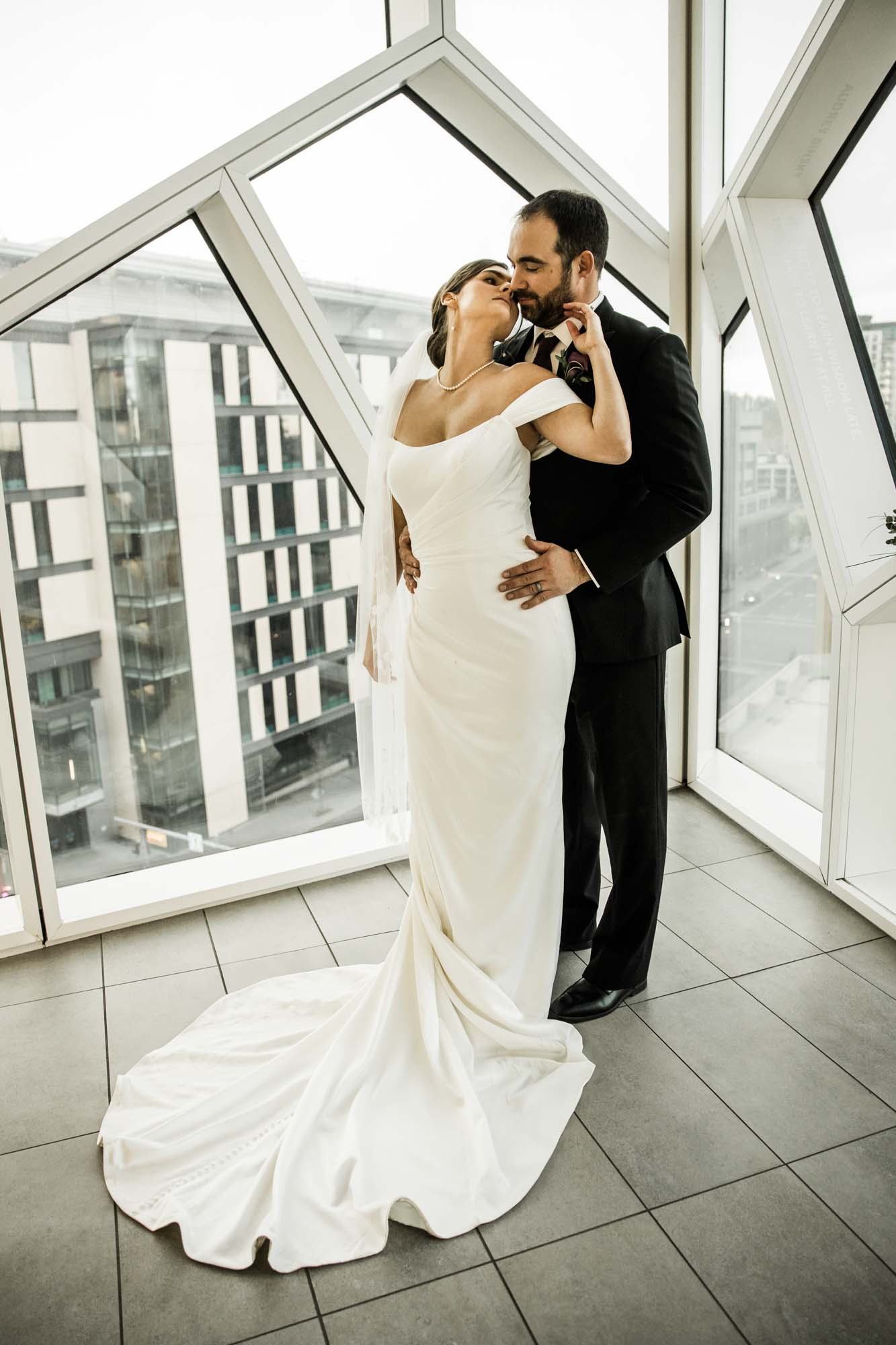 Calgary wedding photographer, bride and groom on their wedding day at the Central Library, candid, documentary, storytelling photography