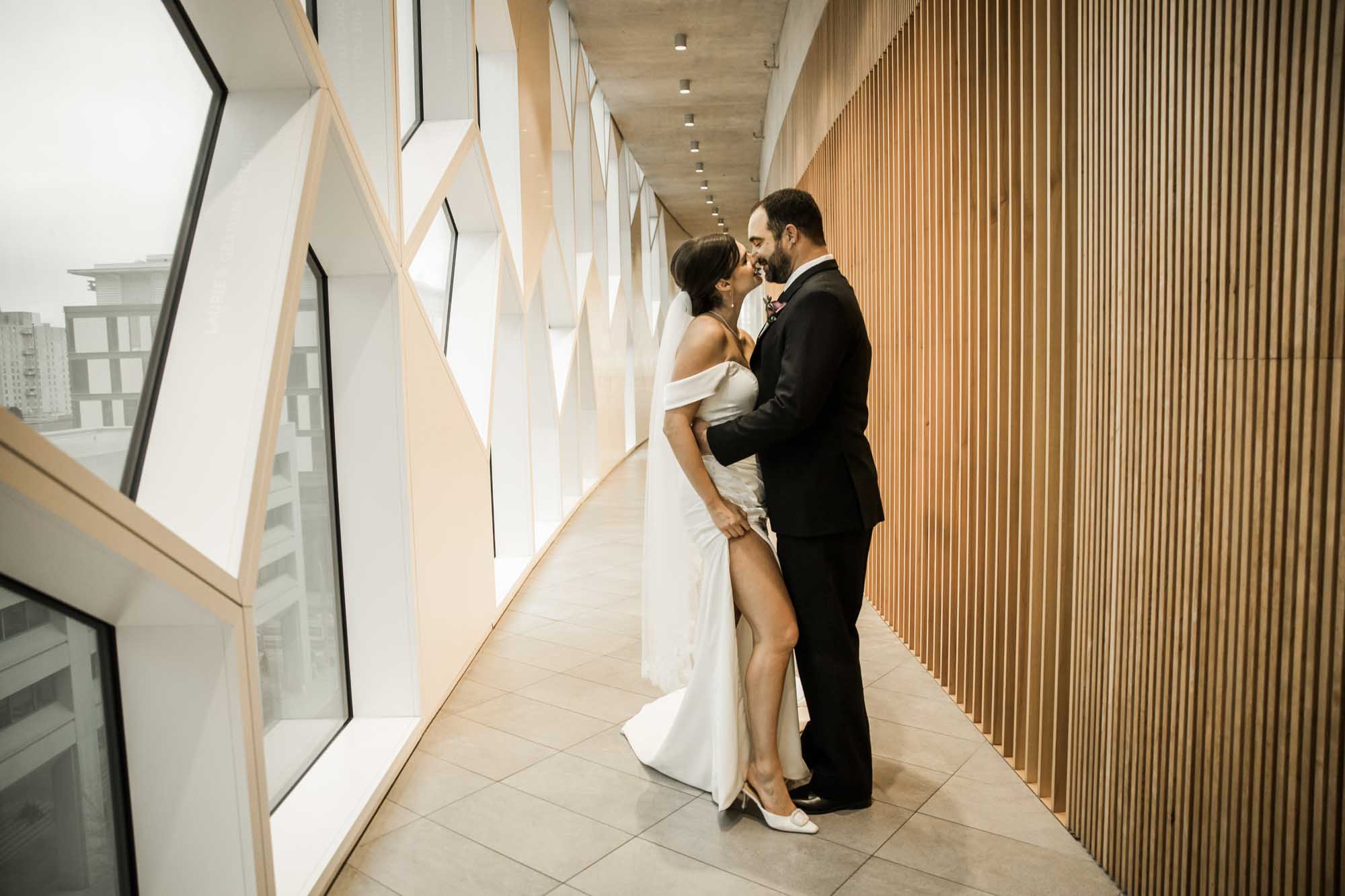 Calgary wedding photographer, bride and groom on their wedding day at the Central Library, candid, documentary, storytelling photography