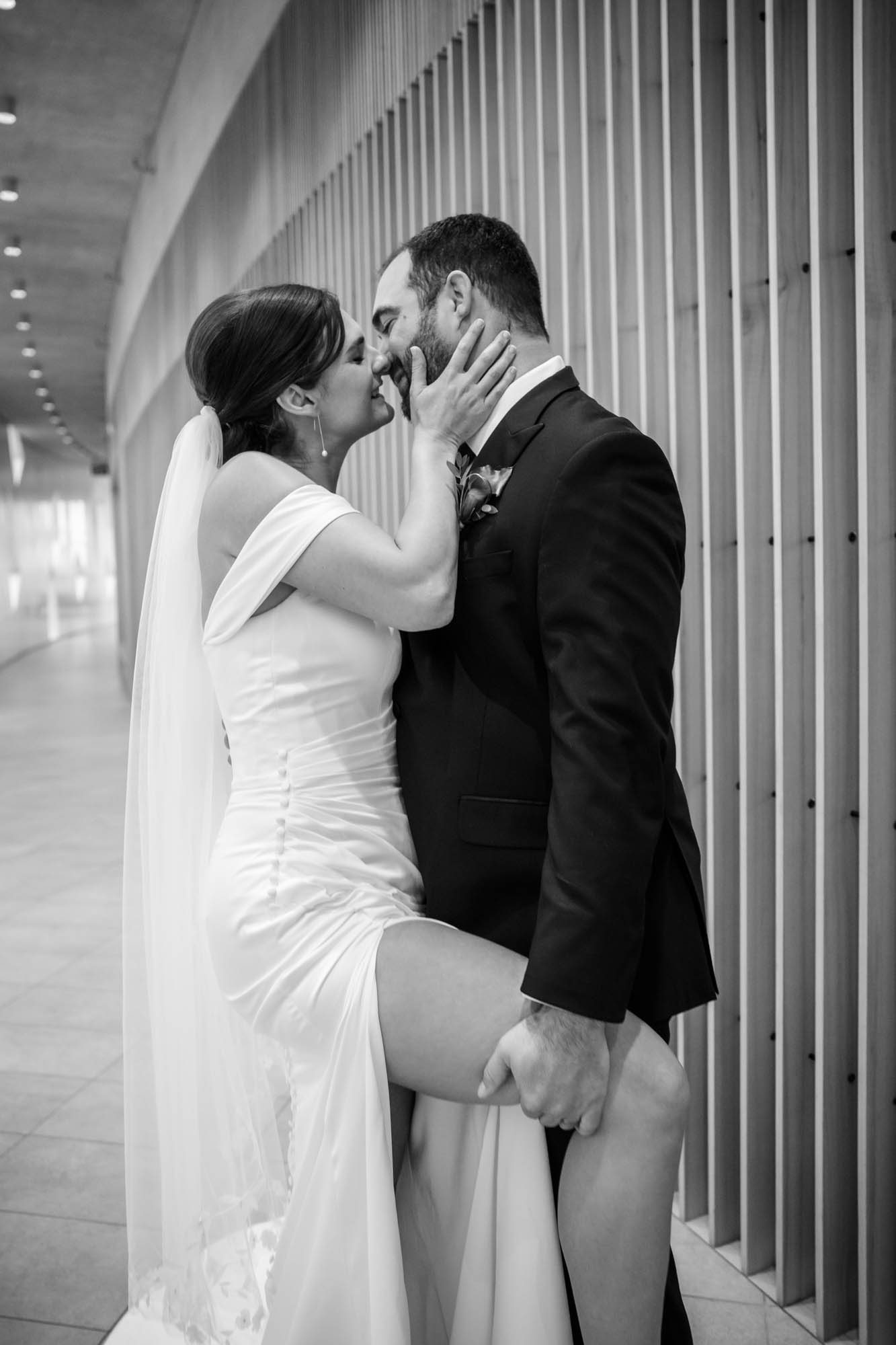Calgary wedding photographer, bride and groom on their wedding day at the Central Library, candid, documentary, storytelling photography